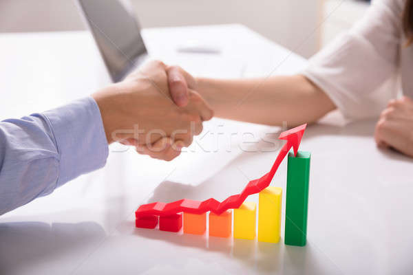 Close-up Of Increasing Multi Colored Graph With Red Arrow Stock photo © AndreyPopov