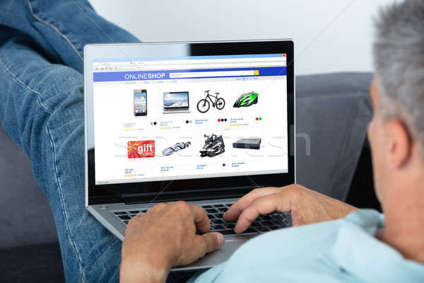 Man Shopping Online On Laptop Stock photo © AndreyPopov