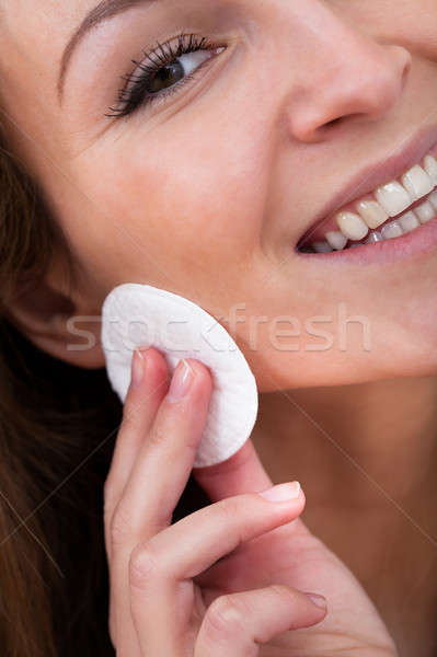 Woman Cleansing Her Face Stock photo © AndreyPopov
