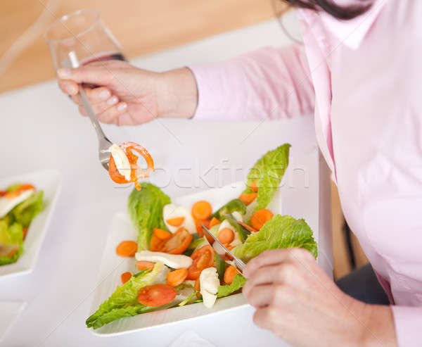 Woman eating salad at home Stock photo © AndreyPopov