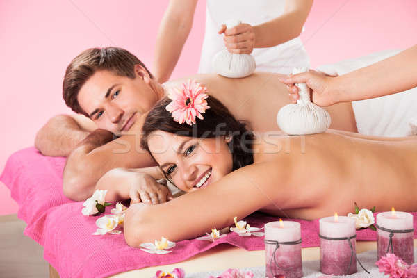 Couple Receiving Massage With Herbal Compress Balls Stock photo © AndreyPopov
