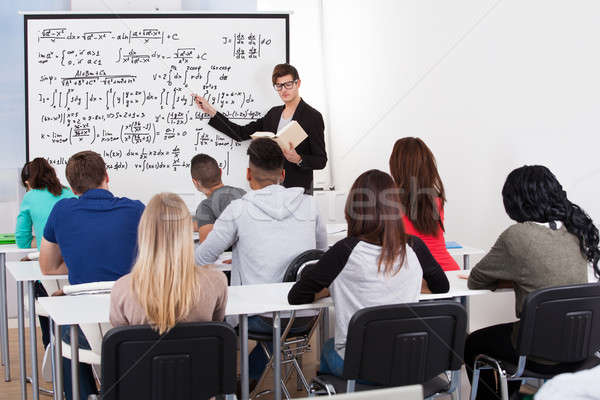 Insegnante insegnamento math formule college studenti Foto d'archivio © AndreyPopov