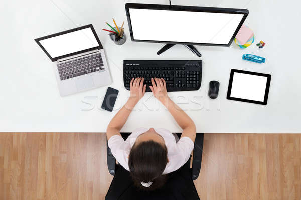 Businesswoman With Multiple Computers Stock photo © AndreyPopov