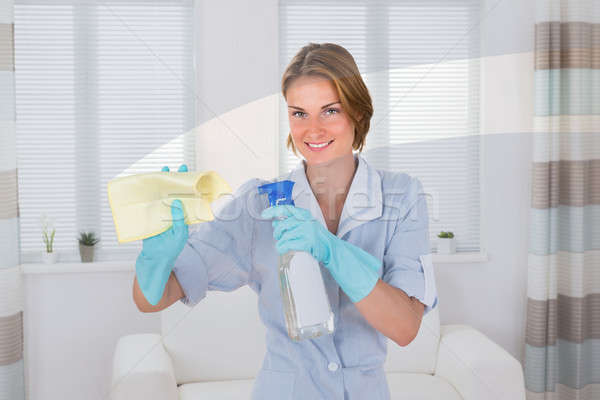 Female Maid Wiping Glass With Rag Stock photo © AndreyPopov