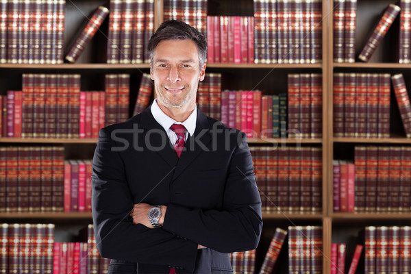 Confident Mature Attorney Standing With Arms Crossed Stock photo © AndreyPopov