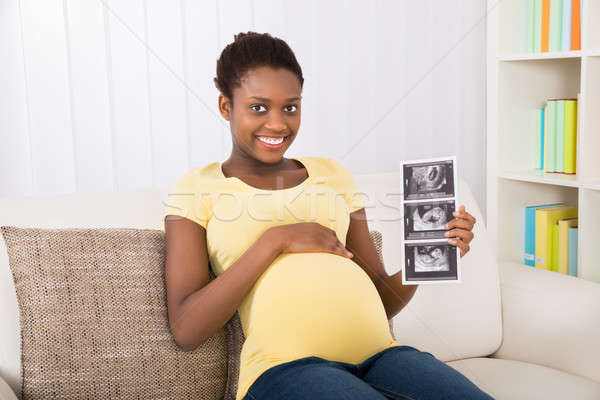 Mulher grávida ultra-som esquadrinhar feliz sessão Foto stock © AndreyPopov