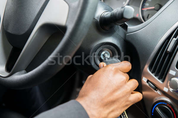 Person's Hand Inserting Key To Start Car Stock photo © AndreyPopov