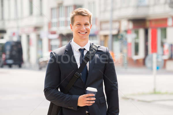 Young Businessman Walking On Street Stock photo © AndreyPopov