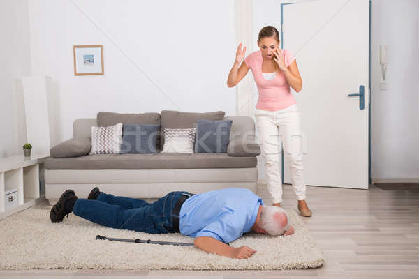 Woman Looking At Her Fainted Disabled Father Stock photo © AndreyPopov