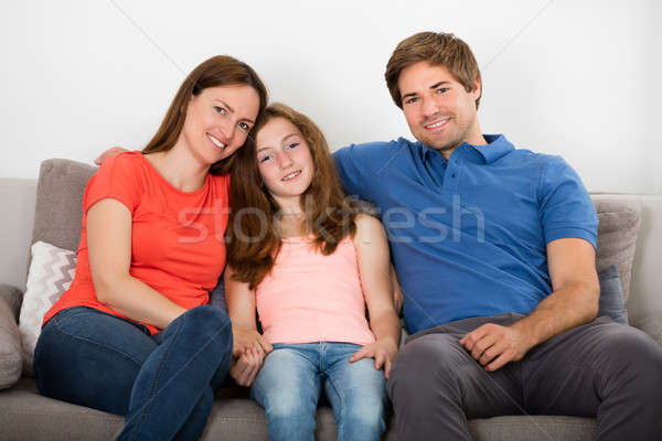 Familia sesión sofá feliz Pareja hija Foto stock © AndreyPopov