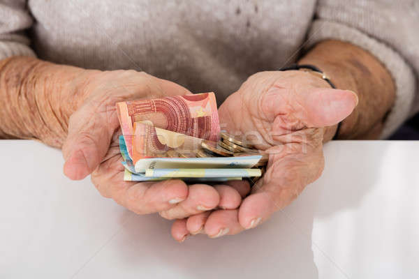 Senior Woman Showing Money On Palm Stock photo © AndreyPopov