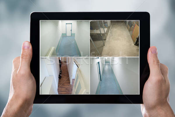 Person Monitoring Cameras Live View On The Tablets Stock photo © AndreyPopov