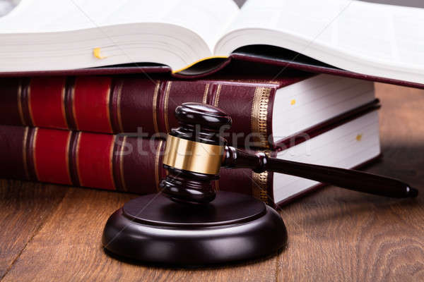 Gavel With Books On Wooden Desk Stock photo © AndreyPopov