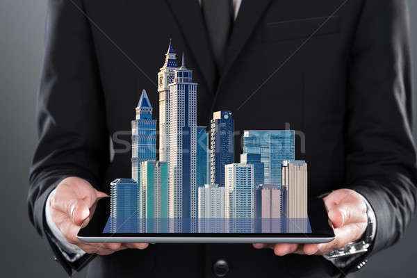 Building Models Emerging From Tablet Stock photo © AndreyPopov