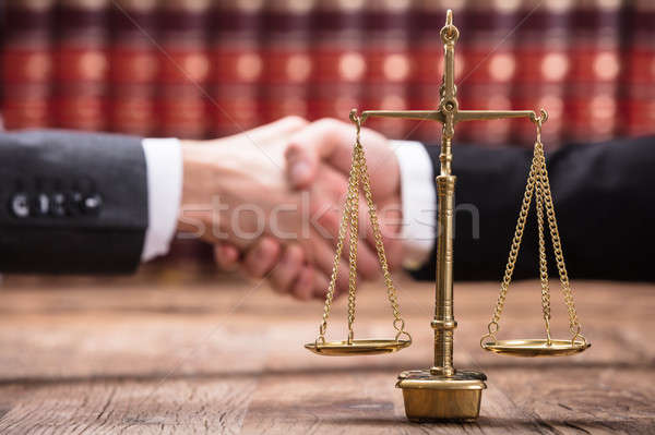 Close-up Of Justice Scale On Wooden Desk Stock photo © AndreyPopov