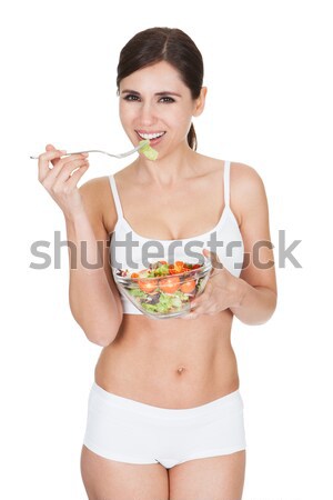 Young Woman Eating Salad Stock photo © AndreyPopov