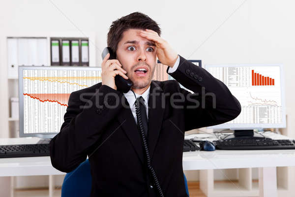 Worried stock broker on the phone Stock photo © AndreyPopov