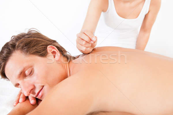 Férfi akupunktúra kezelés közelkép póló nélkül orvosi Stock fotó © AndreyPopov