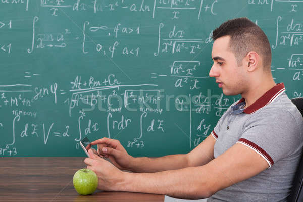 Male Student Using Digital Tablet In Class Stock photo © AndreyPopov