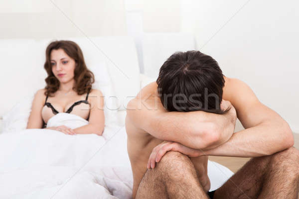 Triste couple matelas argument torse nu homme Photo stock © AndreyPopov