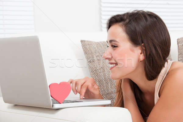 Stock photo: Beautiful Woman Dating Online On Laptop