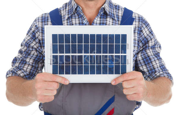 Manuel travailleur panneau solaire blanche construction Photo stock © AndreyPopov