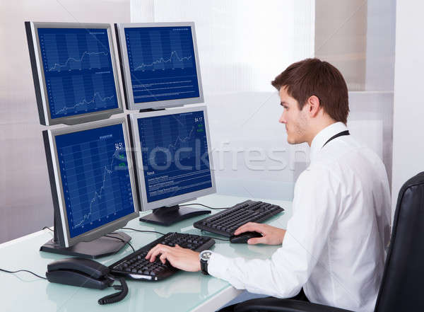 Stock Broker Working At Office Stock photo © AndreyPopov
