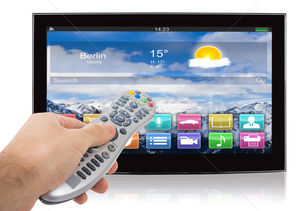 Mão controle remoto inteligente tela plana televisão branco Foto stock © AndreyPopov