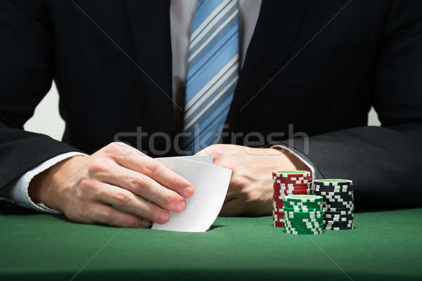 Poker Player Hand With Cards And Chips Stock photo © AndreyPopov