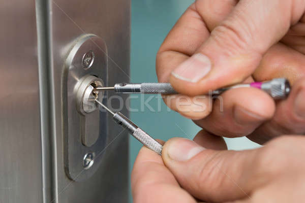 Lockpicker Fixing Door Handle At Home Stock photo © AndreyPopov