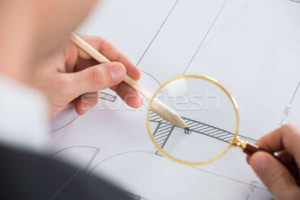 Architect Working With Magnifying Glass Stock photo © AndreyPopov