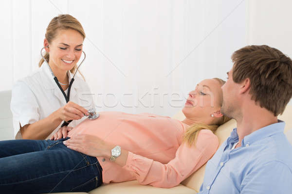 Doctor Examining Pregnant Woman With Stethoscope Stock photo © AndreyPopov