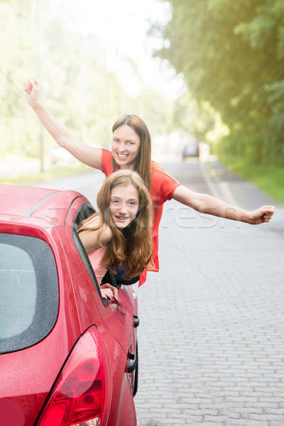 Stock photo: Mother With Her Daughter Going For A Ride In Car