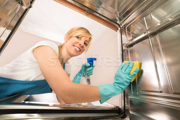 Young Woman Cleaning Inside The Dishwasher Stock photo © AndreyPopov