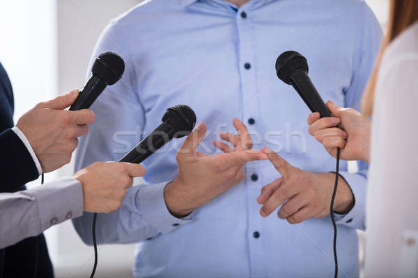 Man Speak Into The Mike In The Media Stock photo © AndreyPopov