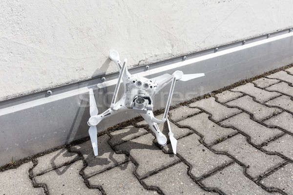 Stock photo: Broken drone on footpath