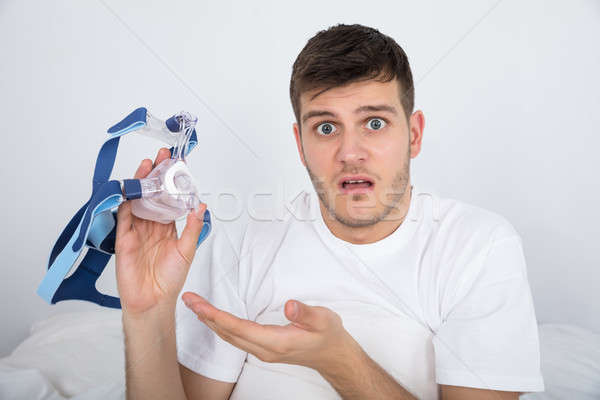 Young Man Holding CPAP Machine Stock photo © AndreyPopov