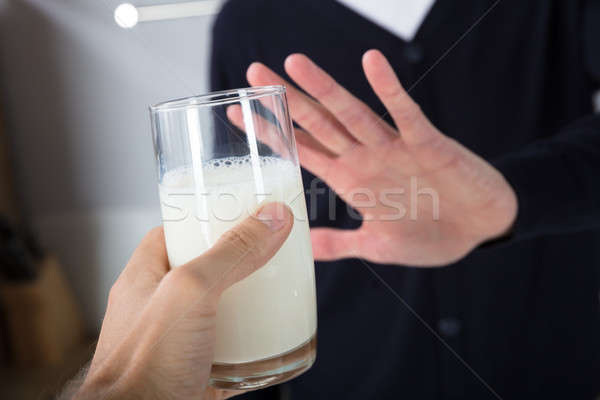 Person Rejecting Glass Of Milk Stock photo © AndreyPopov