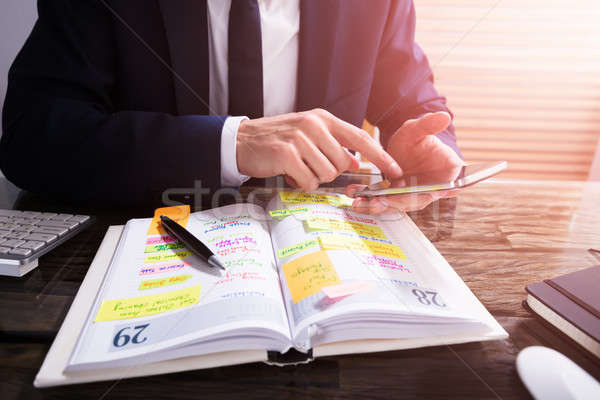 Stock photo: Businessperson Using Mobile Phone