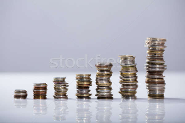 Stack Of Increasing Coins On Desk Stock photo © AndreyPopov