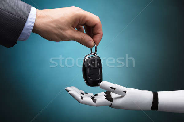 Businessperson Giving Car Key To Robot Stock photo © AndreyPopov