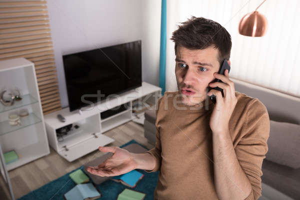 Férfi beszél telefon lopott dolgok aggódó Stock fotó © AndreyPopov