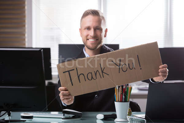 Businessman Holding Cardboard With Thank You Text Stock photo © AndreyPopov
