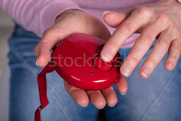 Nő kisajtolás személyes riasztó gomb közelkép Stock fotó © AndreyPopov