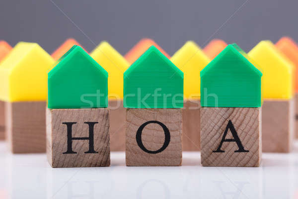 Close-up Of House Model Over Wooden Block Stock photo © AndreyPopov