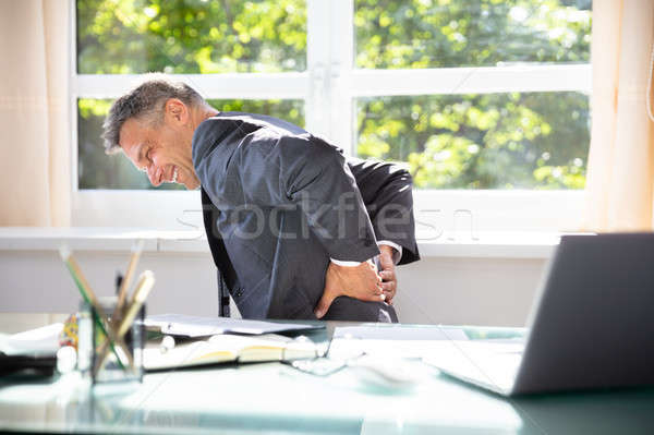 Businessman Suffering From Back Pain Stock photo © AndreyPopov