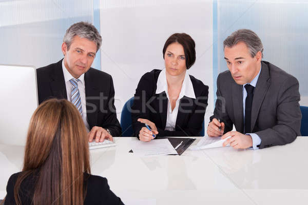 Businesspeople Interviewing Woman Stock photo © AndreyPopov