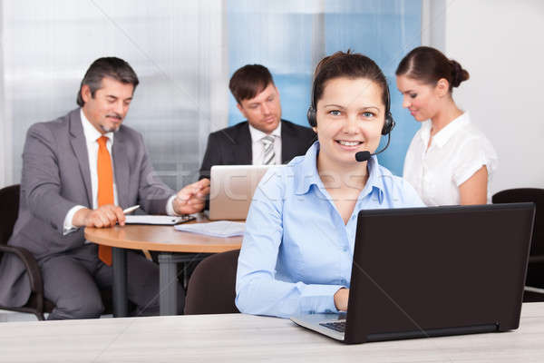 Female Customer Care Executive Working At Office Stock photo © AndreyPopov