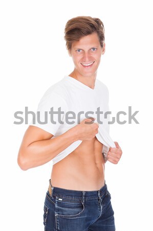 Man Showing His Abs Stock photo © AndreyPopov