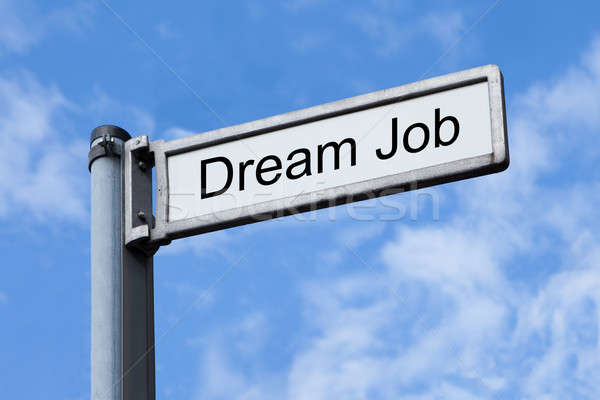 Signpost With Dream Job Sign Against Sky Stock photo © AndreyPopov